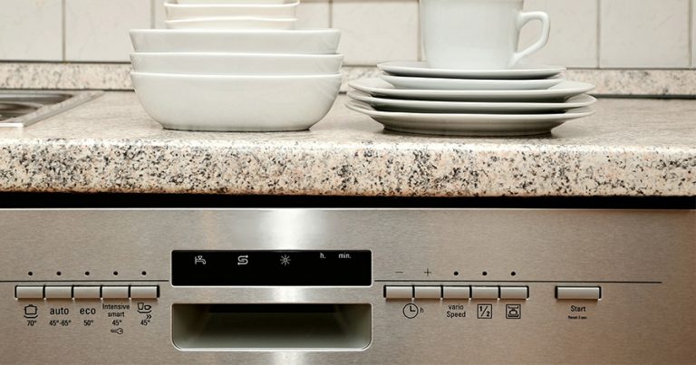 Dishwasher with plates and bowls on counter