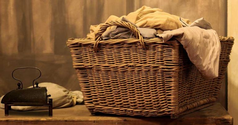 Wicker laundry basket filled with clothes
