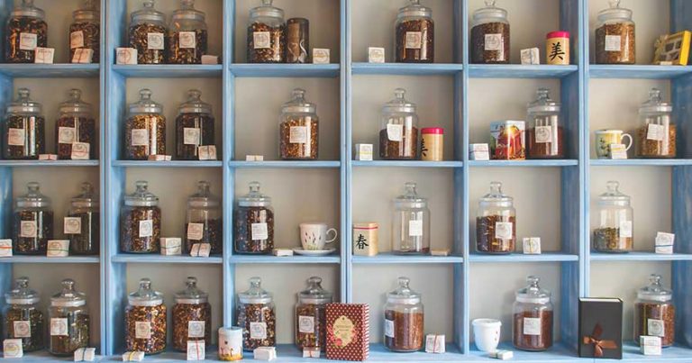 Shelves with glass jars on them