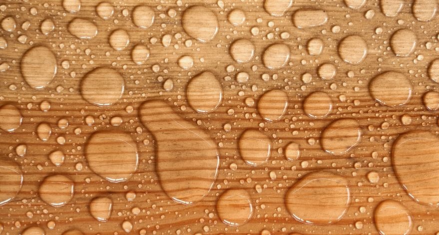 Hardwood floors with water droplets.