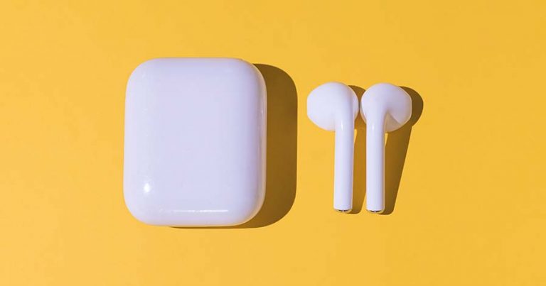 An AirPods case and a pair of AirPods against a yellow background.